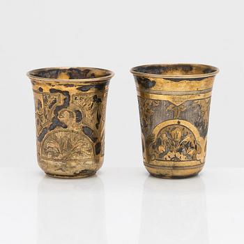 Four parcel-gilt silver beakers, Moscow 1870, 1876 and 1890.
