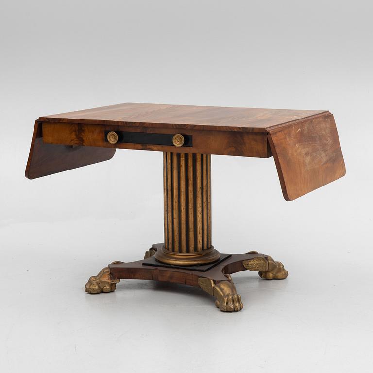 An Empire table, first half of the 19th Century.