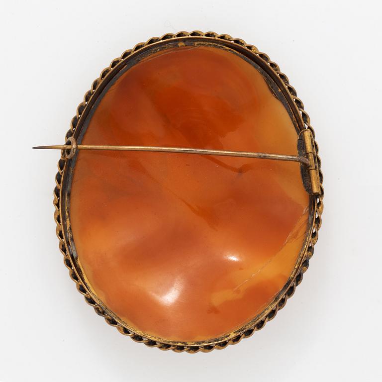 A large shell cameo brooch.