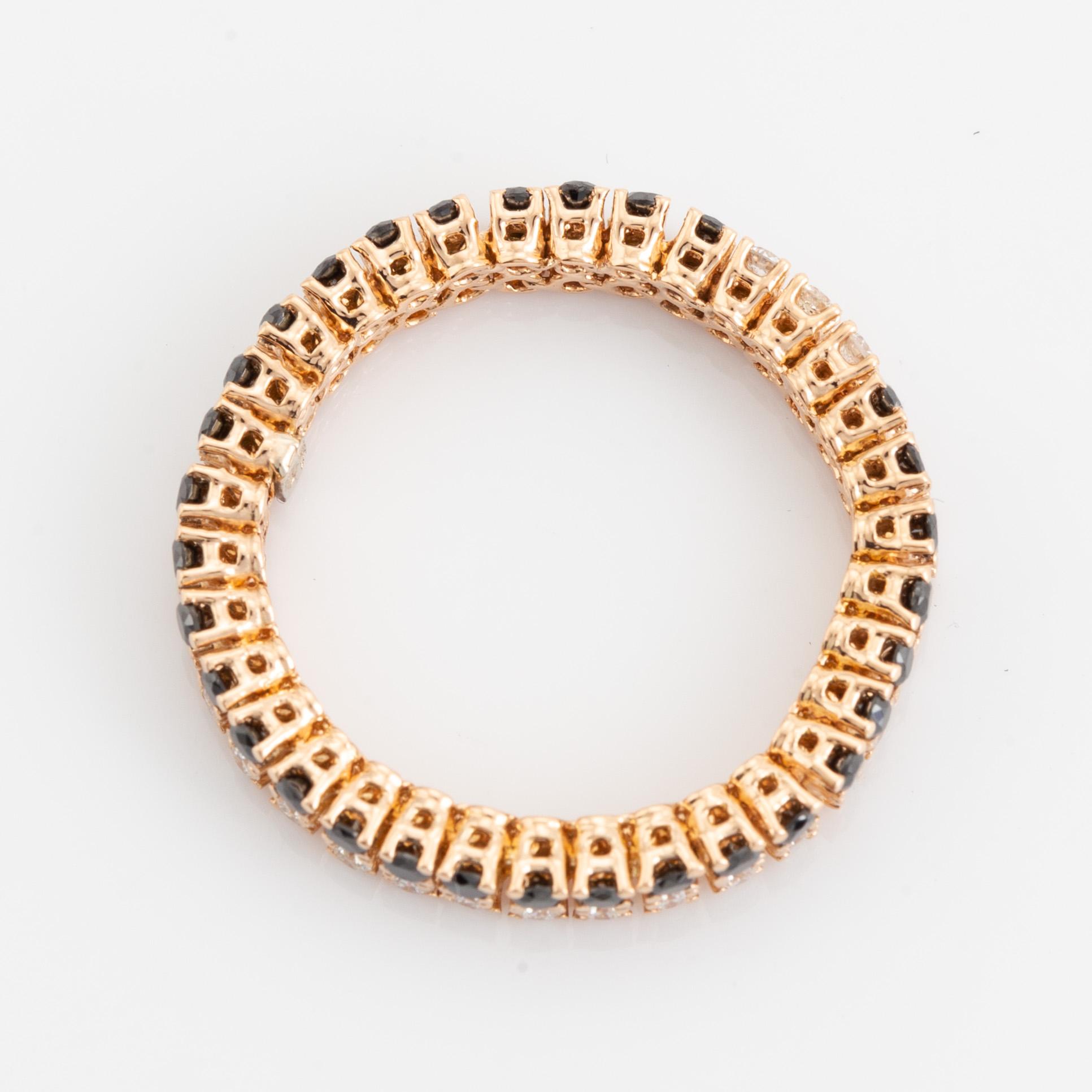 Black and colourless diamond ring.
