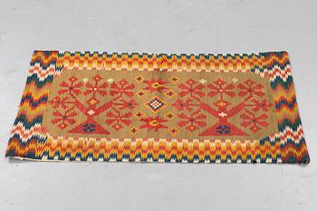 A carriage cushion, double-interlocked tapestry, ca 50 x 99,5 cm, Scania, (Sweden), first half of the 19th century.