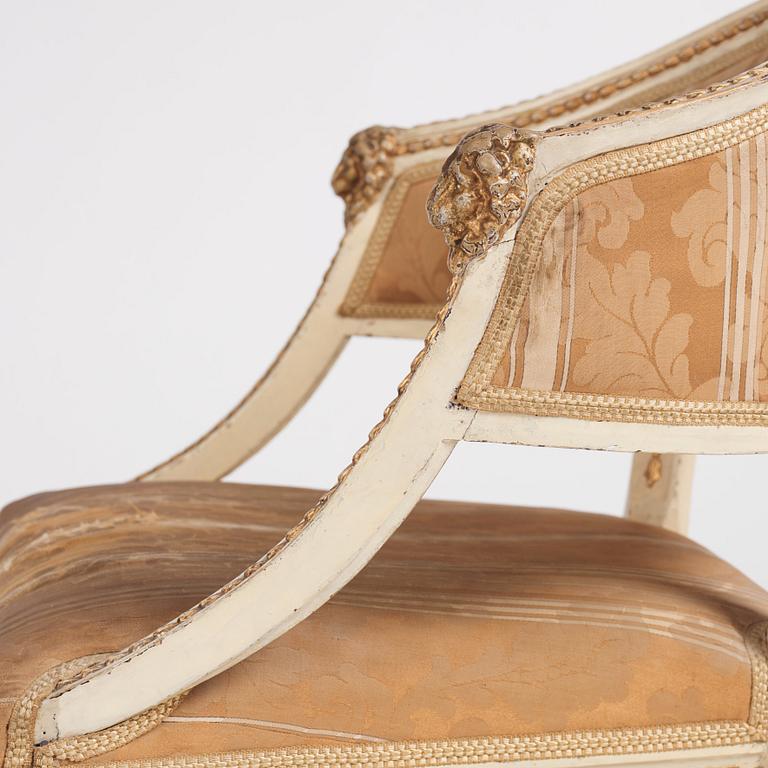 A late Gustavian carved and part-gilt open armchair, late 18th century.