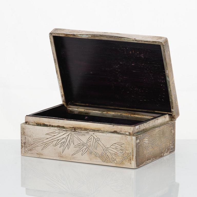 A set with 2 Chinese silver boxes, a coaster and a match stick holder, 20th Century.