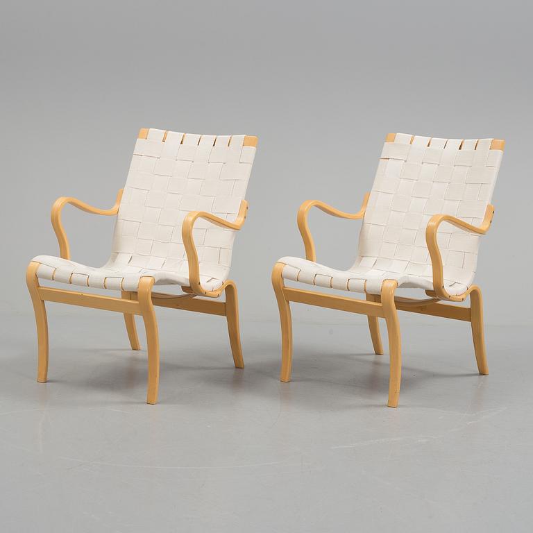 a pair of "Mina" armchairs by Bruno Matsson.