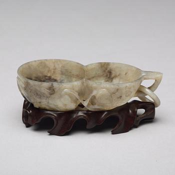 A Chinese group of three sculptured cups.