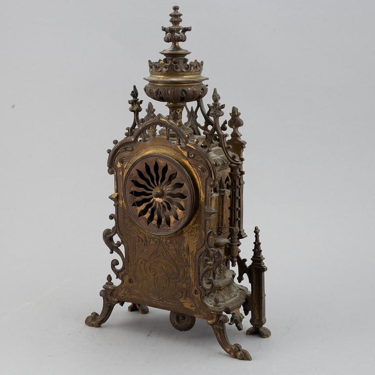 A mantle clock with pair of candelabra, late 19th century.