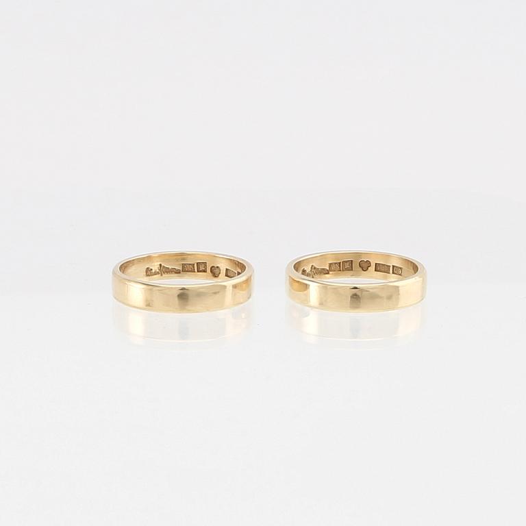 Wiwen Nilsson, a pair of 18K gold rings with a box shaped like a hymn book, Lund 1970.