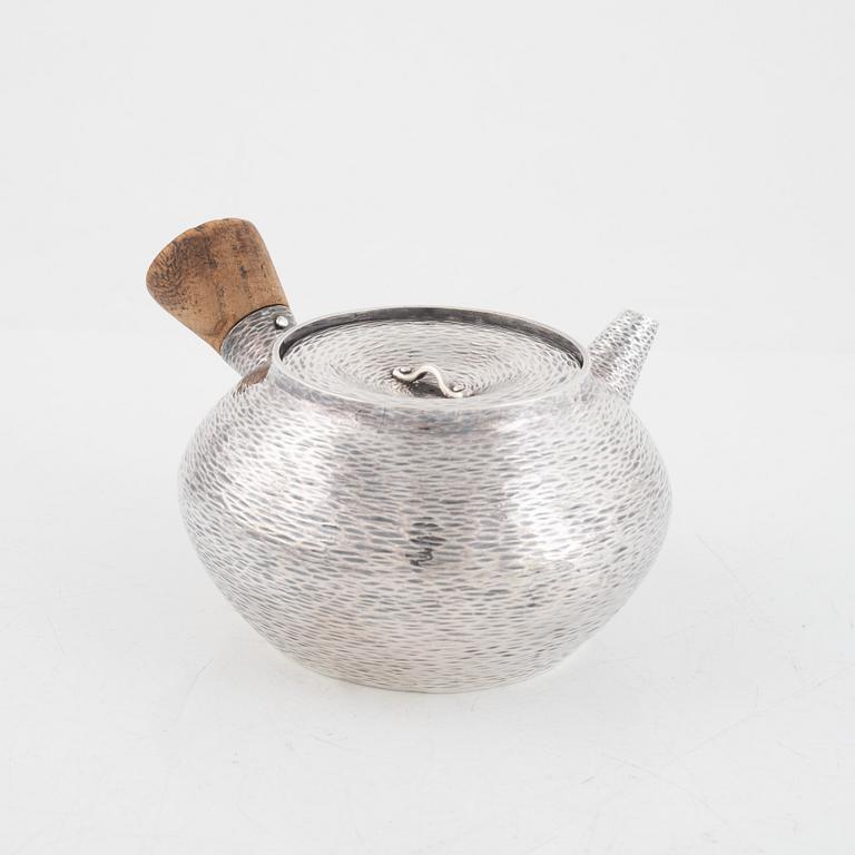 A silver teapot, first part of the 20th century.