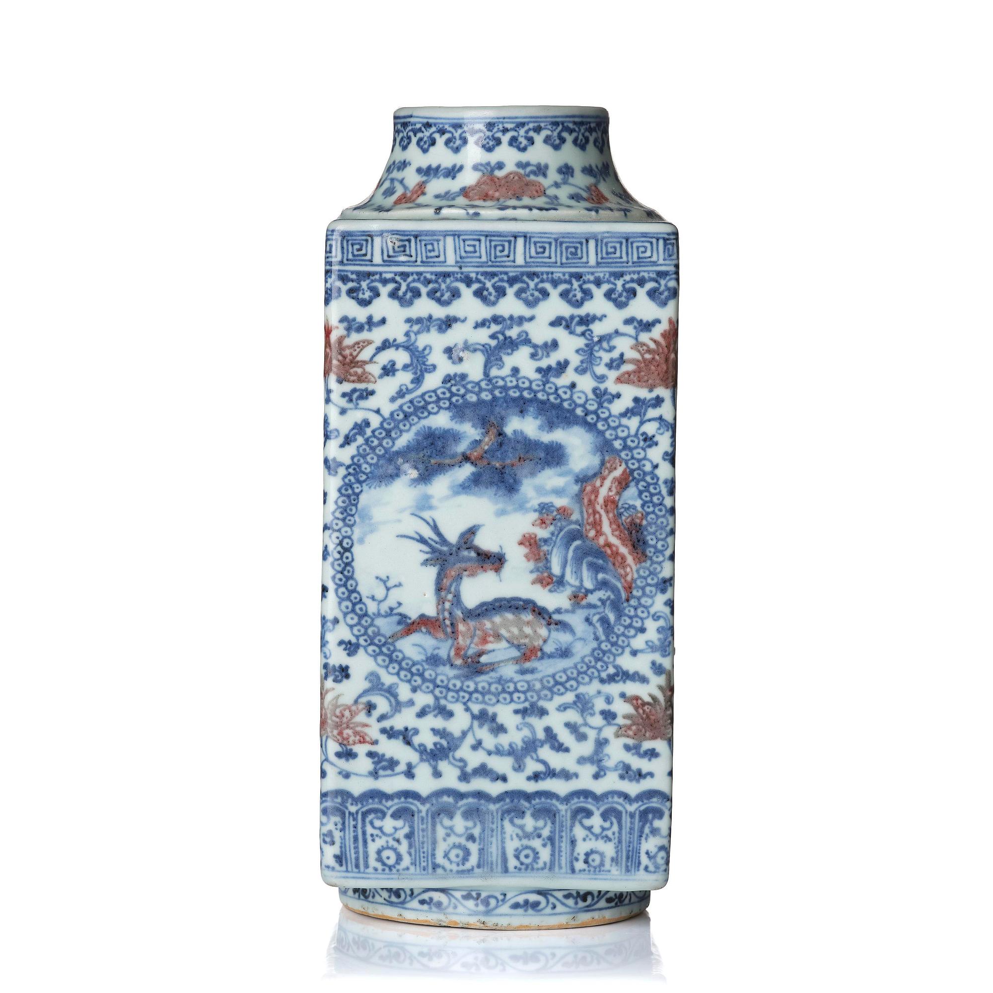 An underglaze blue and copper-red 'crane and deer' cong vase, Qing dynasty, 18/19th century.