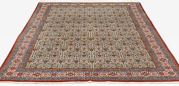 A carpet, semi-antique, Qum, ca 324 x 221 cm.