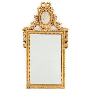 A bronzed gustavian style mirror from the second half of the 20th century.