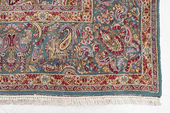 A Kirman carpet, c. 335 x 232 cm.