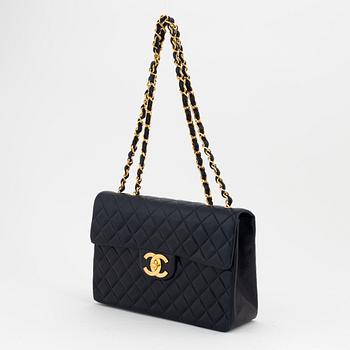 Chanel a black leather and gold hardware 'Maxi flapbag', 1991-1994.