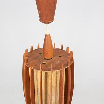 A mid 1900s teak ceiling pendant.