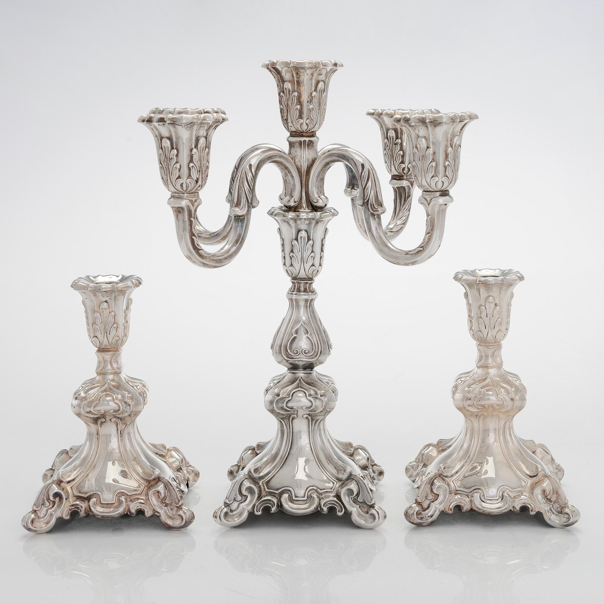A 5-candle silver candelabra and a pair of candlesticks, silver, Auran Kultaseppä, Turku 1984.