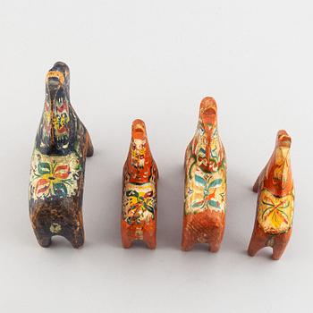 A set of 4 painted wooden horses from the first half of the 20th century.