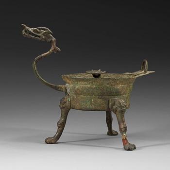 452. An tripod bronze vessel, presumaly Tang dynasty (618-907).