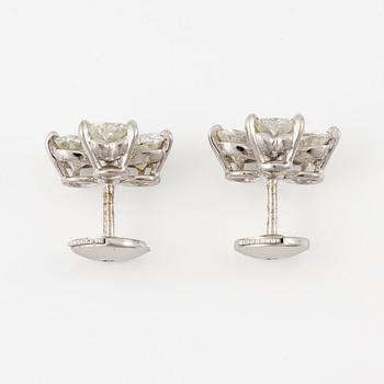 A pair of Cartier earrings in 18K white gold with six heart-shaped brilliant-cut diamonds.