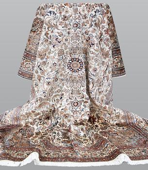 A Kashmir silk carpet, approx. 258 x 201 cm.