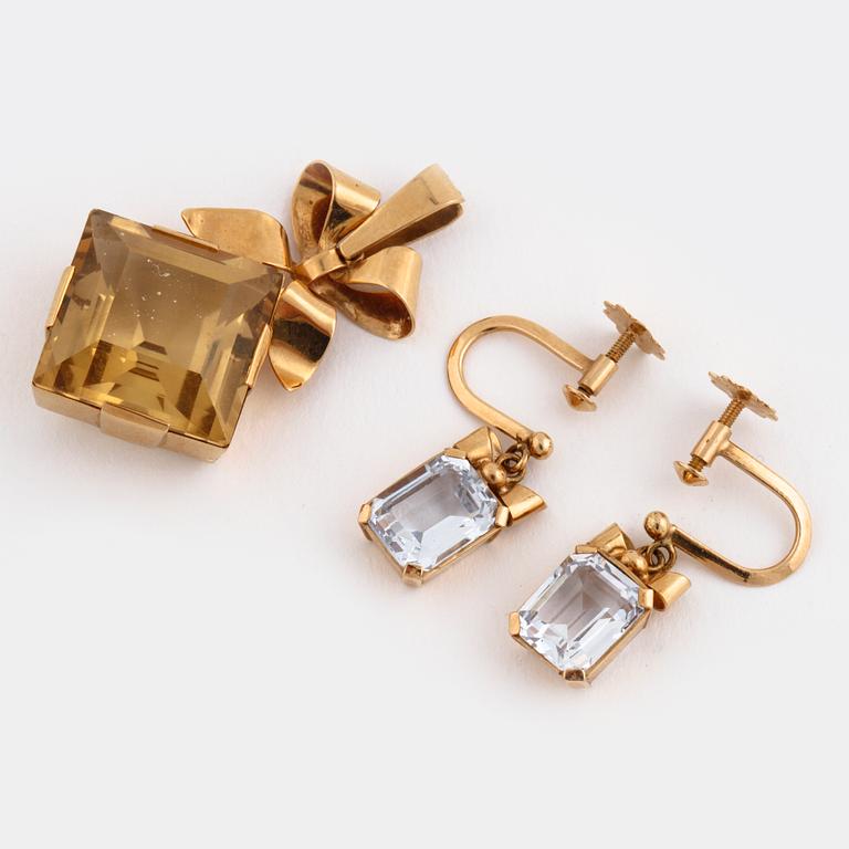 A citrine pendant and a pair of synthetic spinell earrings.