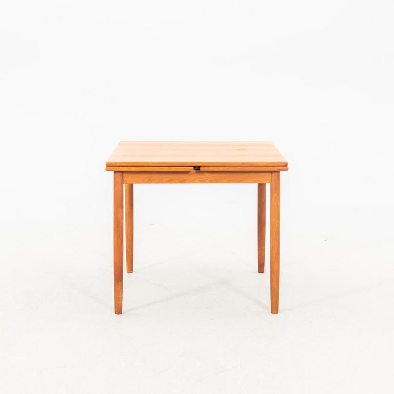 A teak table from the middle of the 20th century.
