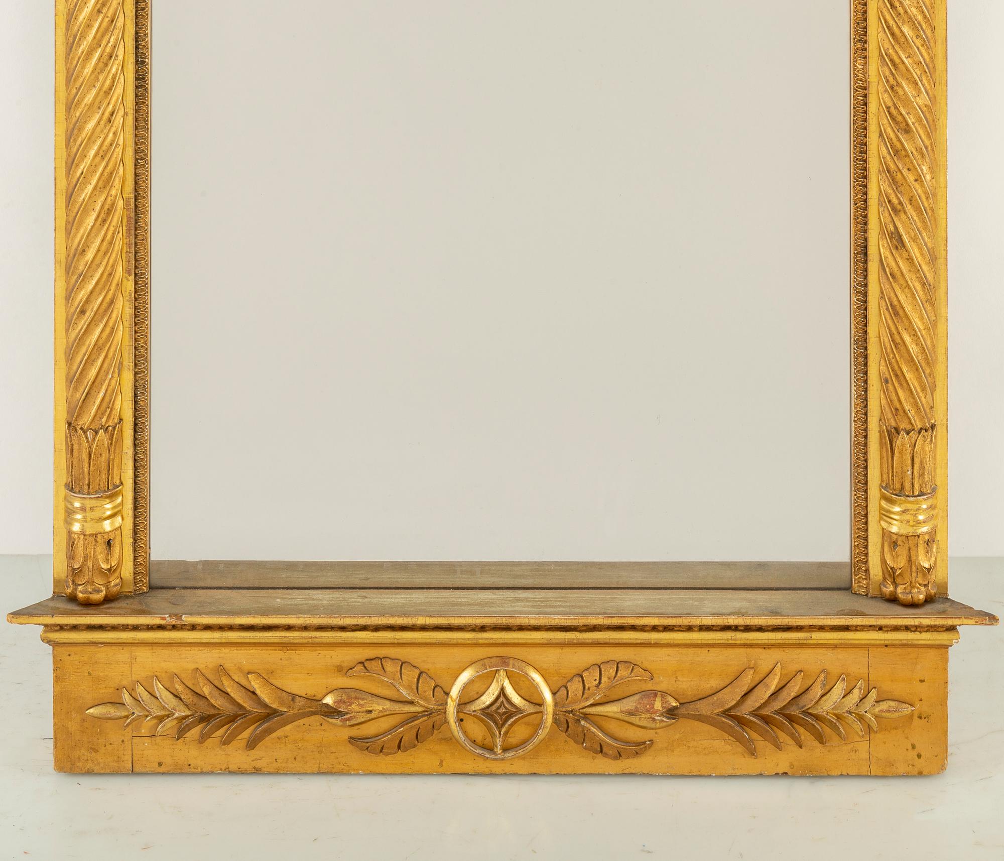 An Empire mirror from the first half of the 19th century.