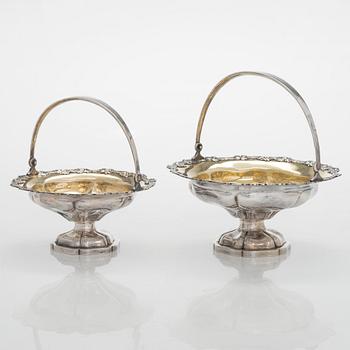 A set of two 1920s-1930s silver sweetmeat basket with sugar tong and jam spoon, Uusi Kultaseppä Oy, Helsinki, Finland.