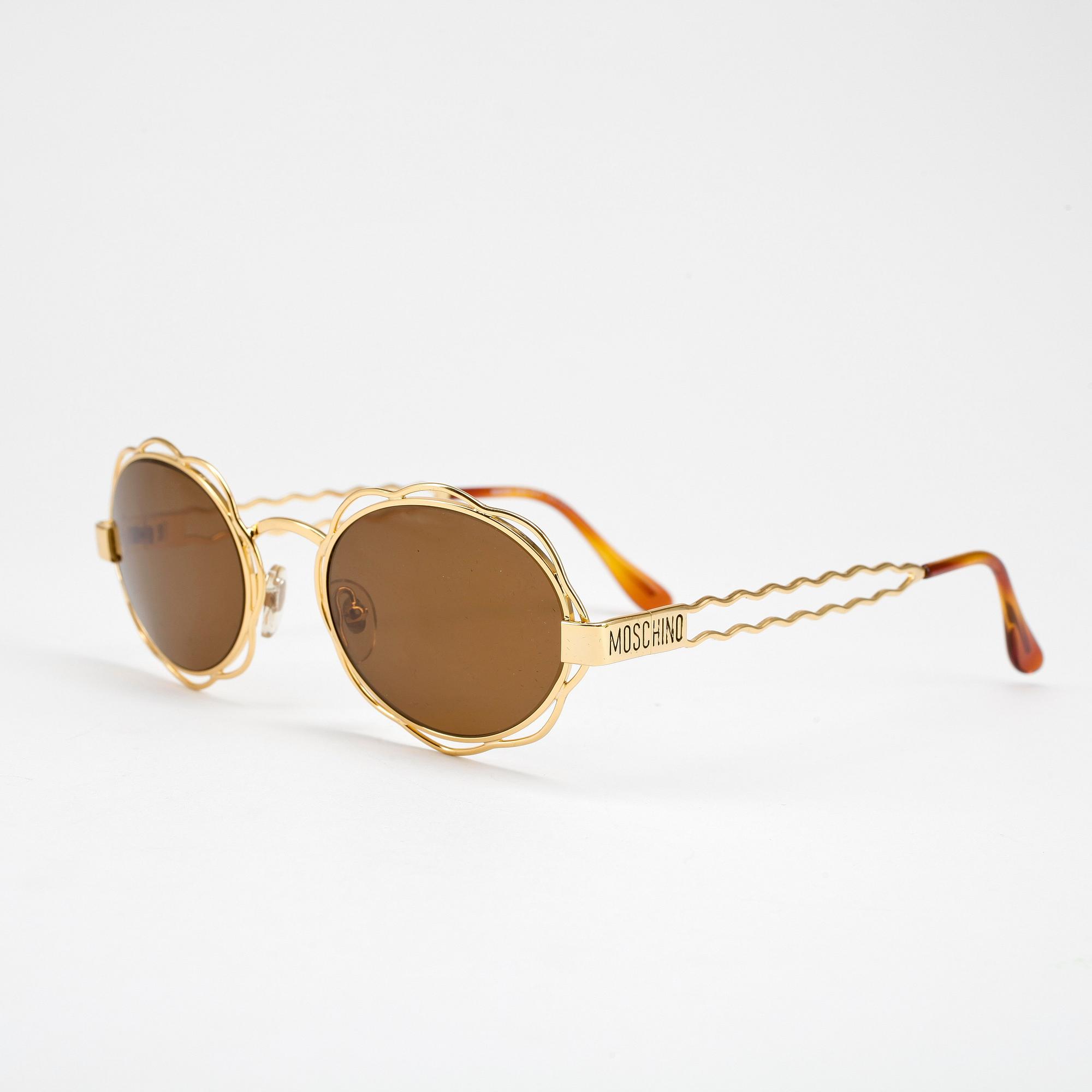 MOSCHINO, a pair of sunglasses.