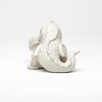 Wilhelm Kåge, a set of stoneware figures of a 'dragon puppy' and two 'dragon puppies' with candle holders, Gustavsberg, ca 1940.