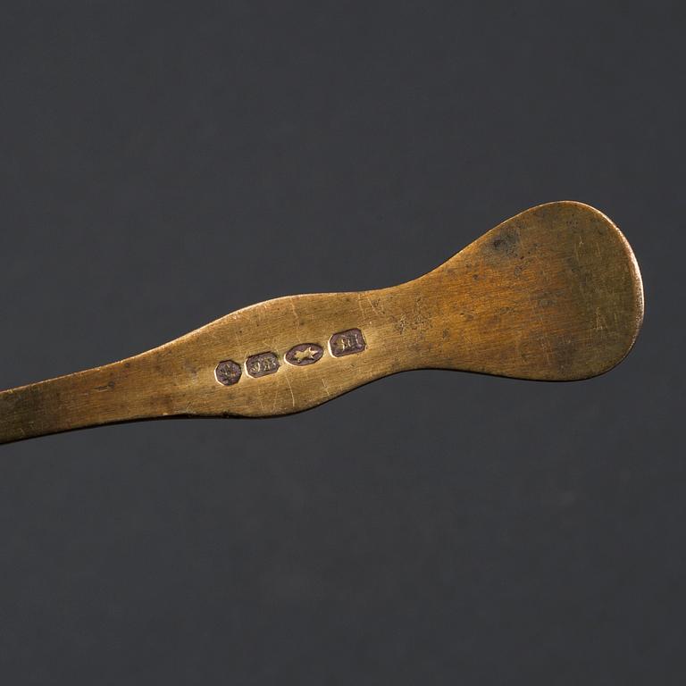 Four 18th century brass and iron spoons.