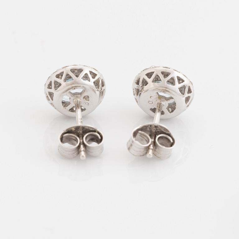 Blue topaz and brilliant cut diamond earrings and necklace.