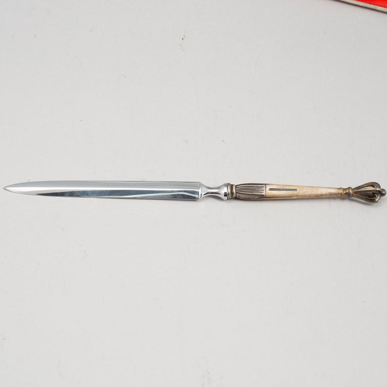 Swedish America Line, six pieces om memorabilia, including W&S Sörensen sterling silver letter opener in original bow.