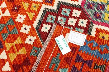 An Afghan kilim rug, c. 290 x 203 cm.