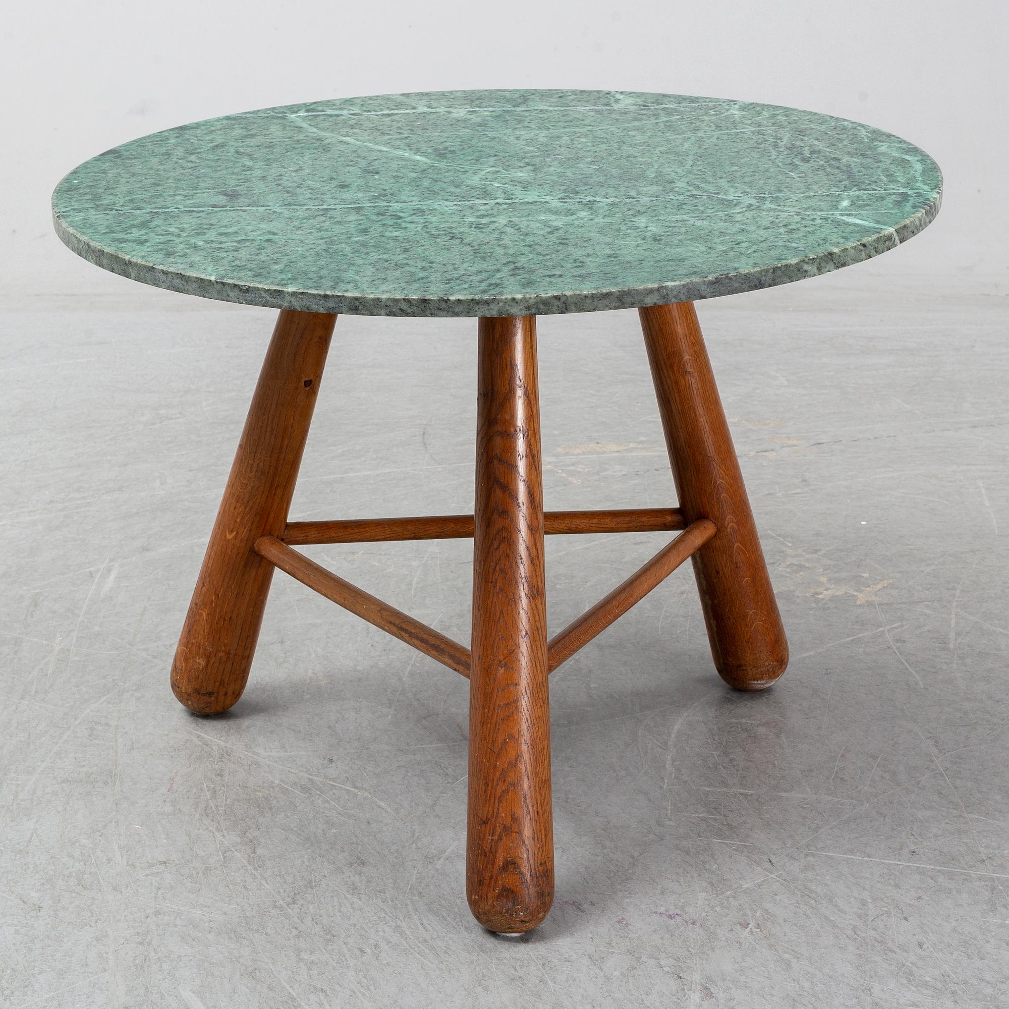 A late 20th century stone and wood coffee table.