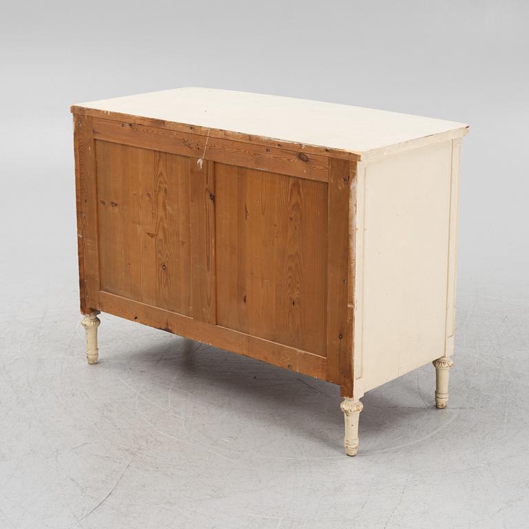 A painted oak chest of drawers from around the year 1900.