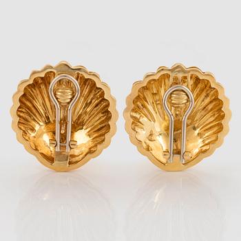 A pair of 18K gold earrings.