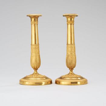 A pair of French Empire early 19th century candlesticks.
