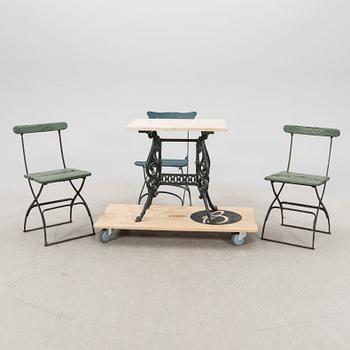 A set of three garden chairs and one cast iron and marble table first half of the 20th century.