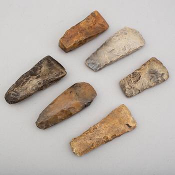 Six neolithic flint axes.