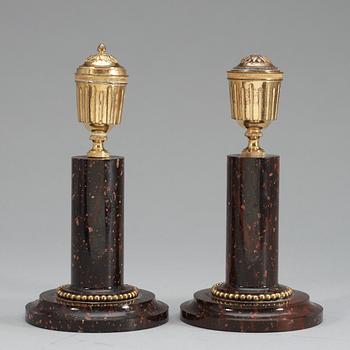 A pair of late Gustavian circa 1800 porphyry and gilt bronze candlesticks.