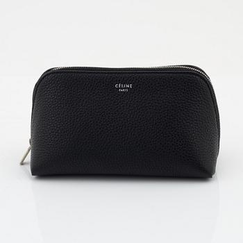 Céline, A small cosmetic pouch in black leather.