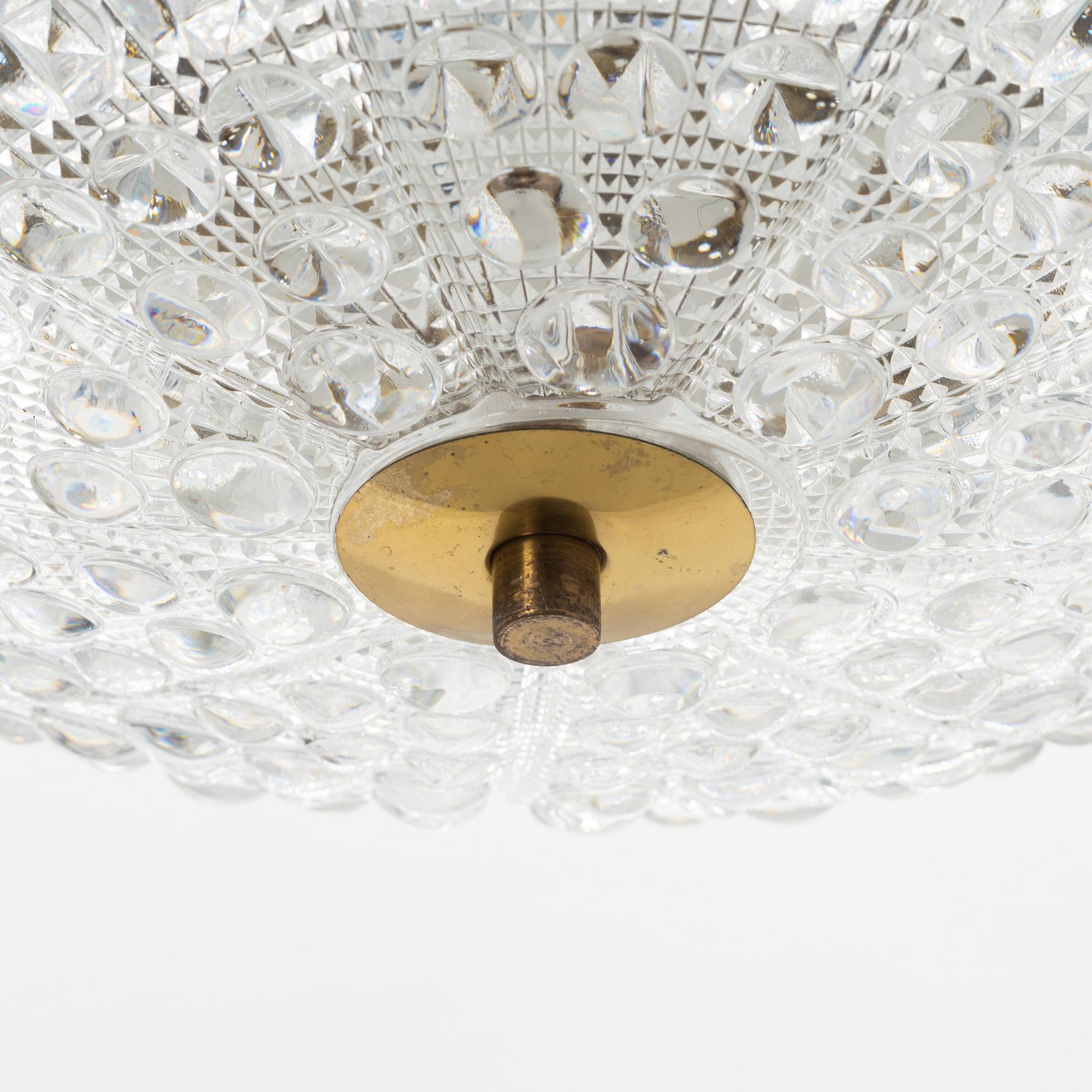 Carl Fagerlund, a glass and brass ceiling light, Orrefors, second half of the 20th Century.