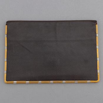 Cartier, troligen. Plånbok.