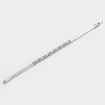 Armband, 14K vitguld med briljantslipade diamanter, Importstämplad A. Tillander 1975.