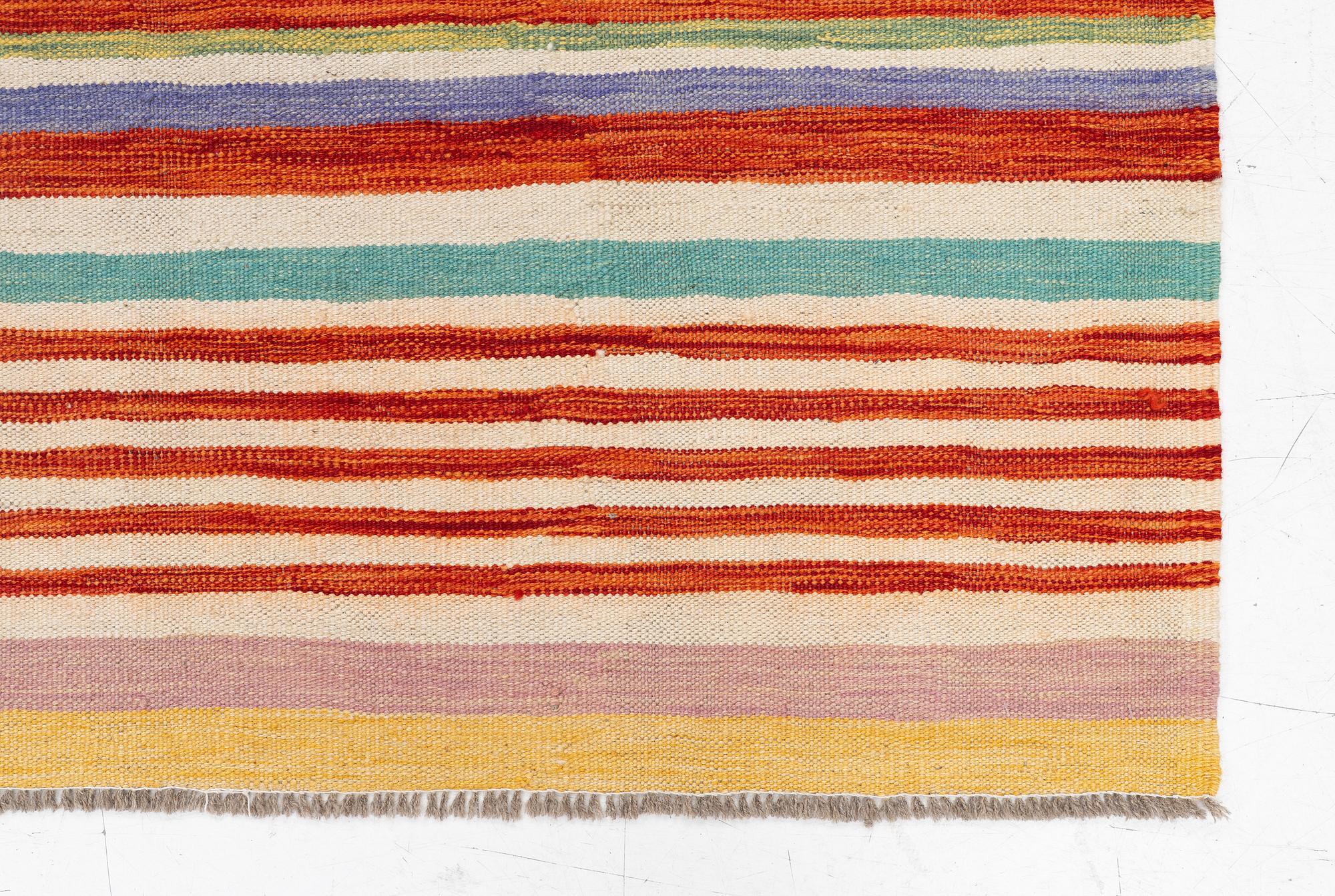 A Kelim rug, c. 200 x 195 cm.