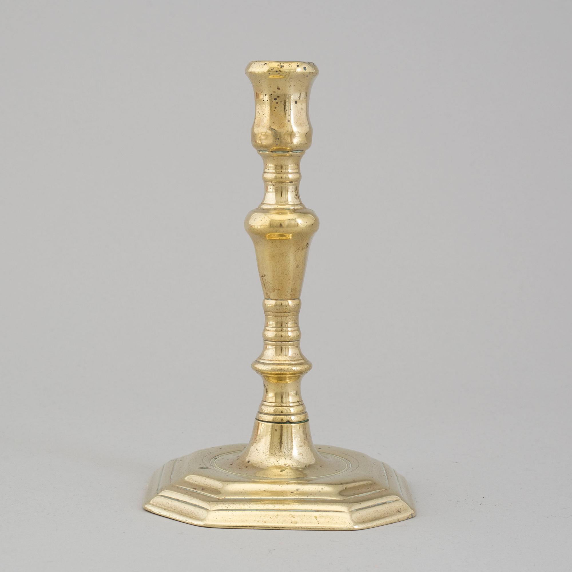An 18th century bronze candlestick.