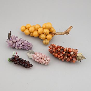 A group of five glass and stone objects, in shapes of fruits, 20th century.