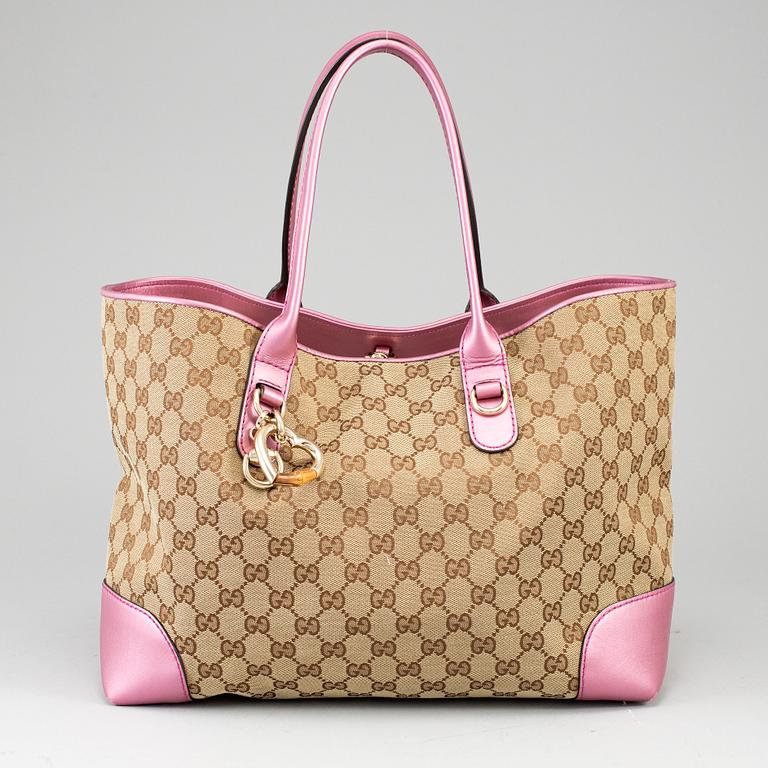 GUCCI, a monogram canvas and pink metallic leather handbag.