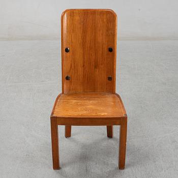 Axel Einar Hjorth, a pair of stained pine "Lovö" chairs, Nordiska Kompaniet, Sweden 1930's.