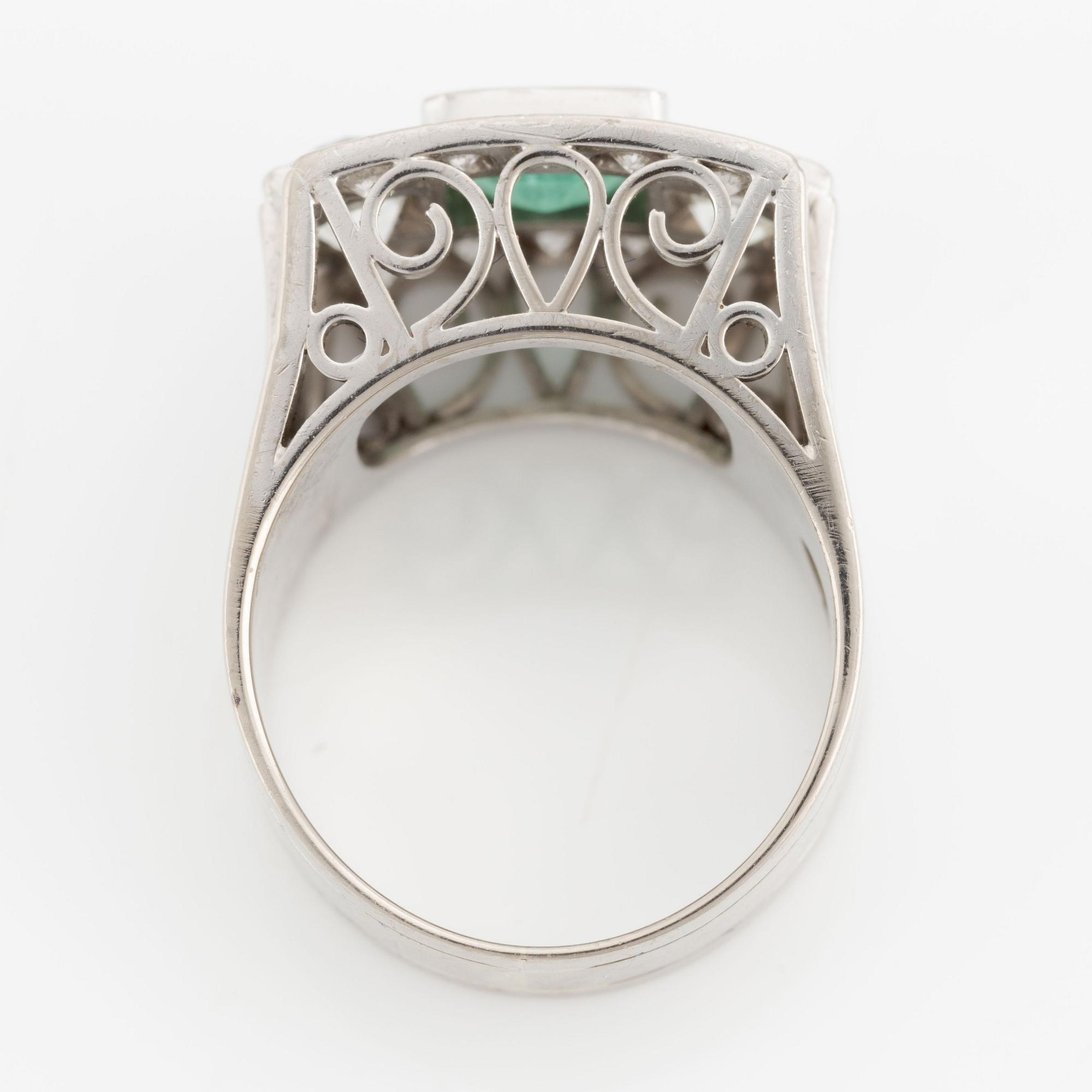 Ring, Hellström & Åhrling. 18K white gold with an emerald and old-cut and brilliant-cut diamonds.